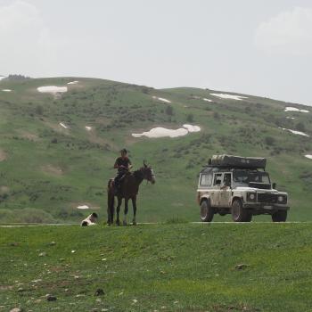 Land Rover next to Kyrgyz Shepherd